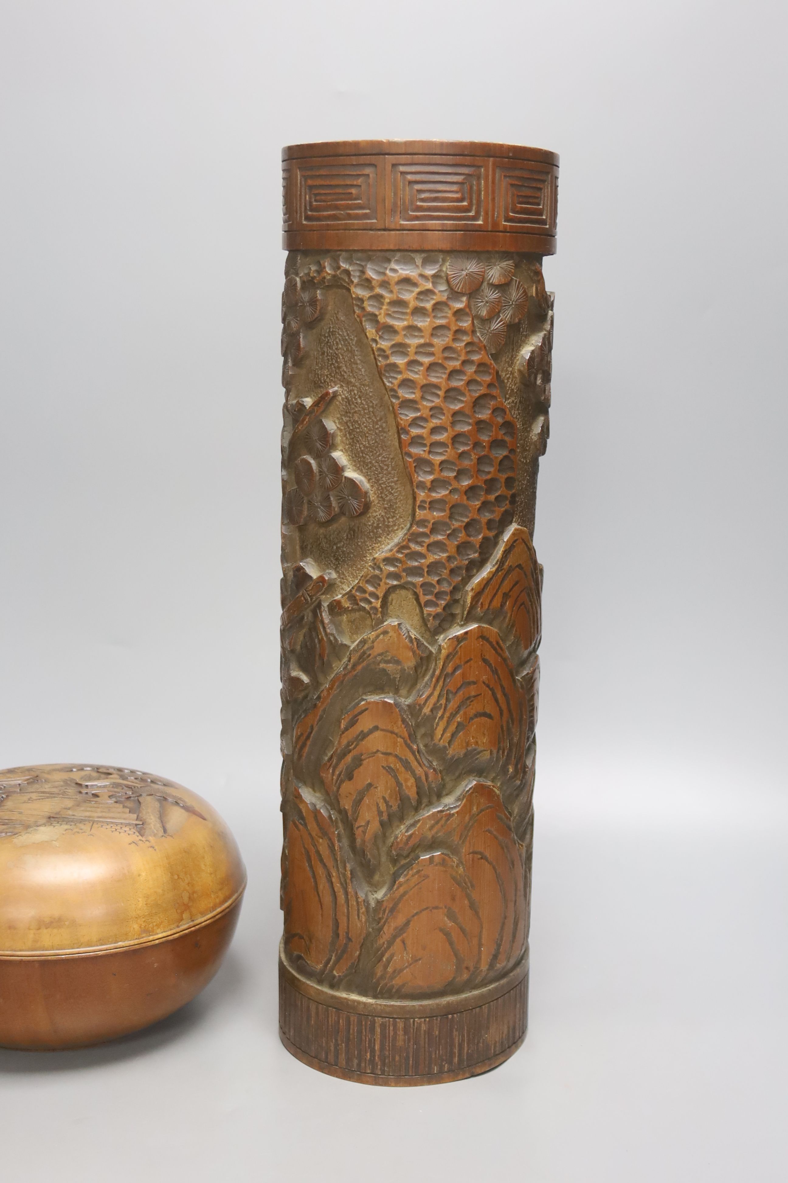 A Japanese carved bamboo brushpot, height 45cm, and Japanese carved wood circular lidded box